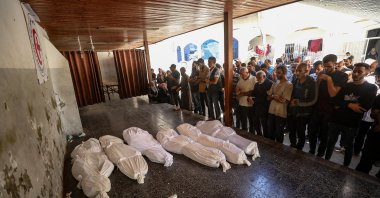 Palestinian relatives of the Abu Shaban family pray beside the bodies of their loved ones at Al Ahli Baptist Hospital in Gaza City, Palestine, Oct. 18, 2025. (EPA Photo)