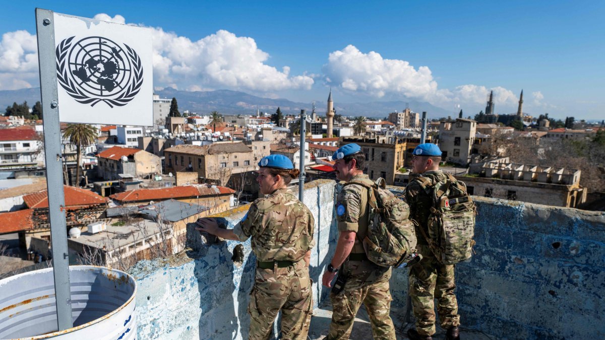 Members of the United Nations Peacekeeping Force in Cyprus stand on a rooftop of an abandoned building while patrolling along the buffer zone, which separates the TRNC and the Greek Cypriot administration, Lefkoşa (Nicosia) on the island of Cyprus, Feb. 21, 2024. (AFP Photo)