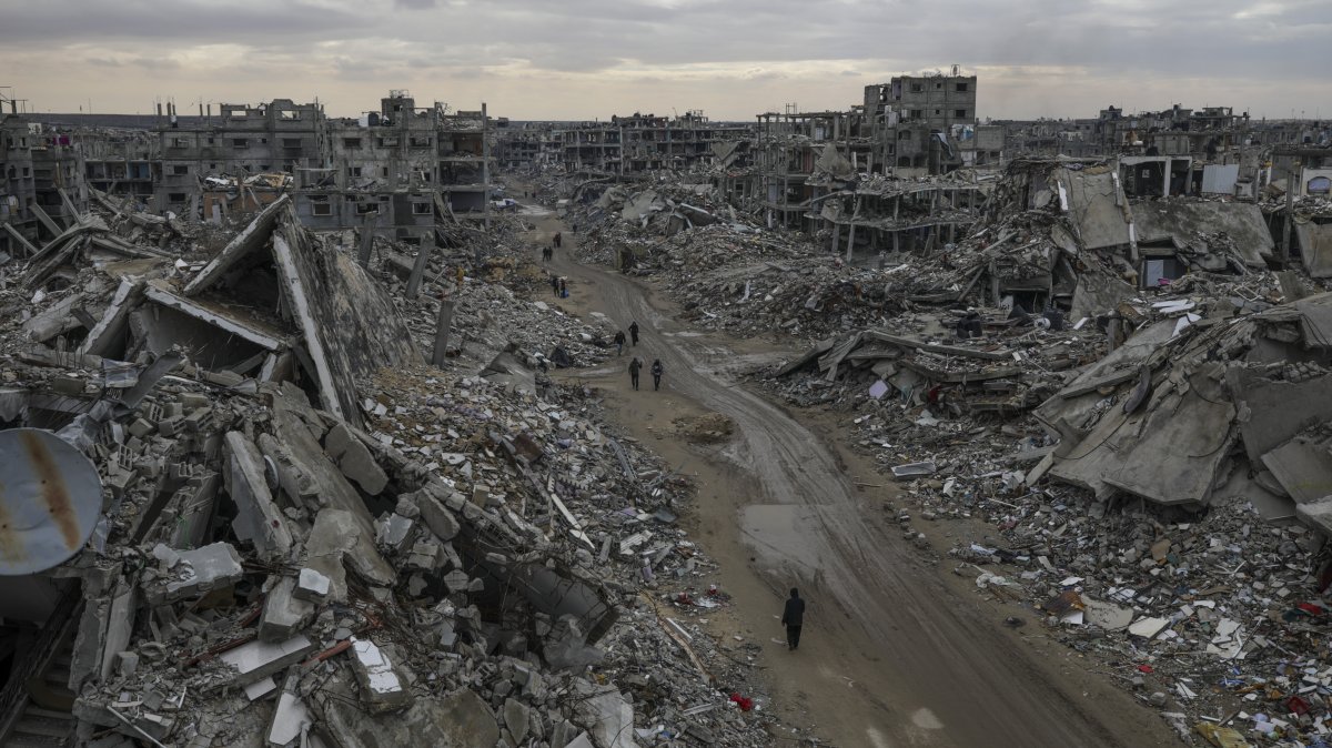 People walk amidst the destruction caused by the Israeli air and ground offensive in Rafah, southern Gaza Strip, Palestine, Feb. 24, 2025. (AP Photo)