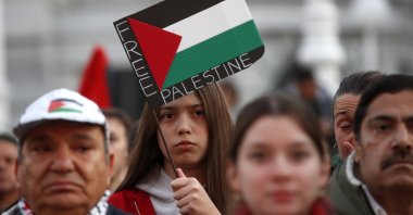 A person holds a flag reading &quot;Free Palestine&quot; during a rally in solidarity with the Palestinian people, Zagreb, Croatia, Oct. 18, 2025. (EPA Photo)