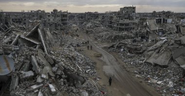 People walk amidst the destruction caused by the Israeli air and ground offensive in Rafah, southern Gaza Strip, Palestine, Feb. 24, 2025. (AP Photo)