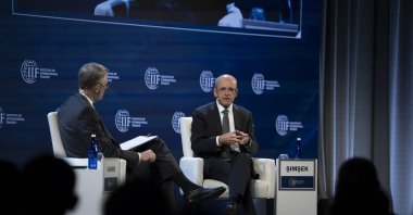 Treasury and Finance Minister Mehmet Şimşek delivers a speech at the Institute of International Finance (IIF), Washington, U.S., Oct. 17, 2025. (AA Photo)