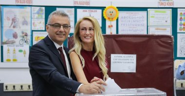 Republican Turkish Party leader Tufan Erhürman and his wife Nilden Erhürman cast their ballots at a polling station, Lefkoşa (Nicosia), TRNC, Oct. 19, 2025. (AFP Photo)