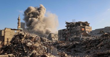 Smoke billows following an Israeli strike that targeted a building in the Bureij camp for Palestinian refugees in the central Gaza Strip, Oct. 19, 2025. (AFP Photo)
