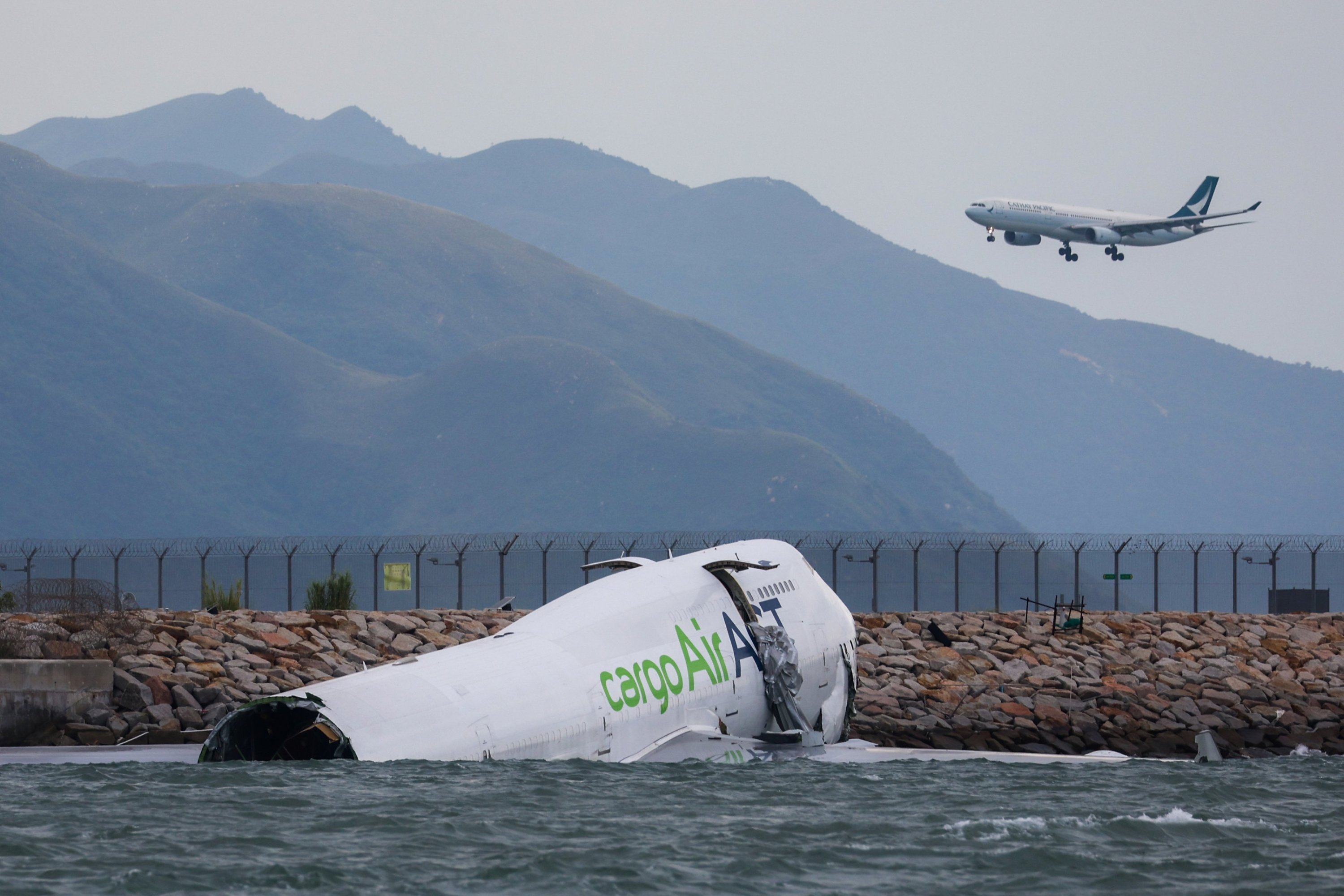 At least 2 dead when cargo plane veers off Hong Kong runway