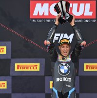 Turkish rider Toprak Razgatlıoğlu celebrates on the podium after winning the 2025 World Superbike Championship, lifting the trophy high as he secures his third world title, at Jerez Circuit, Jerez, Spain, Oct. 19, 2025. (AA Photo)