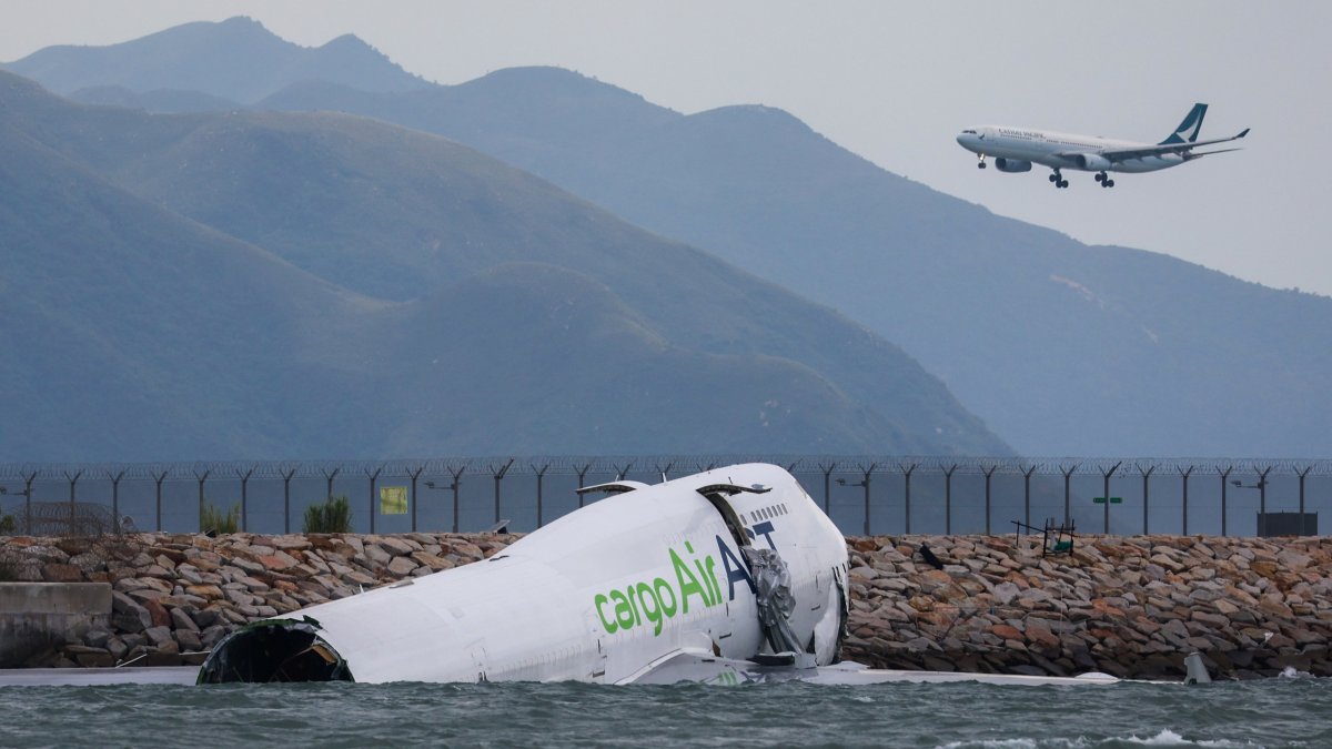 The broken fuselage of a 747-400 cargo plane is seen after it skidded off a runway in Hong Kong, China, Oct. 20, 2025. (AA Photo)