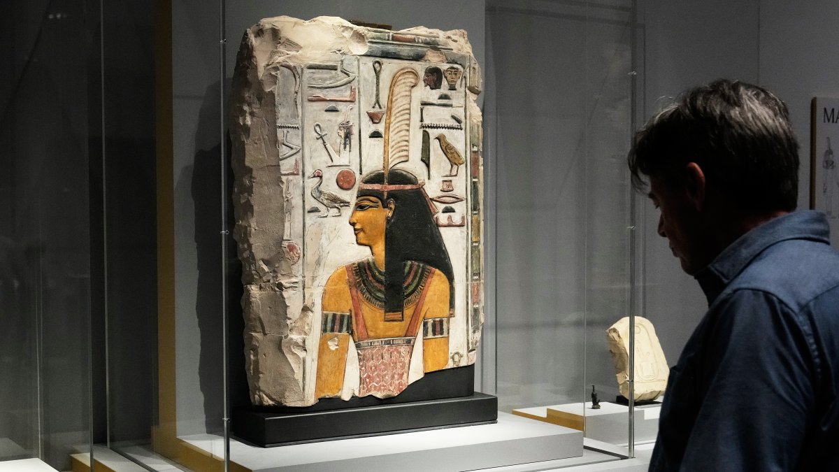 A relief of Maat is displayed in the &quot;Divine Egypt&quot; exhibition, at the Metropolitan Museum of Art, New York, U.S., Oct. 14, 2025. (AP Photo)