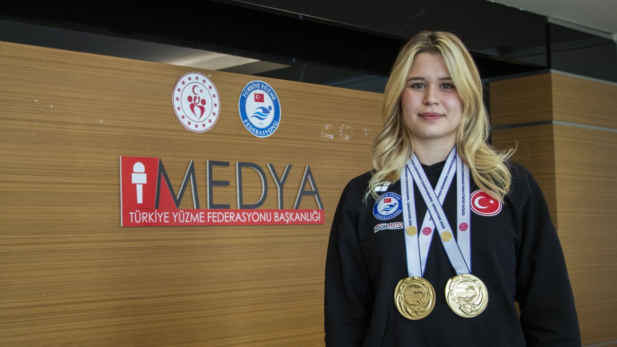 Turkish para swimmer Defne Kurt poses for a photo with her 2025 World Para Swimming Championships gold medals, Ankara, Türkiye, Oct. 10, 2025. (AA Photo) 