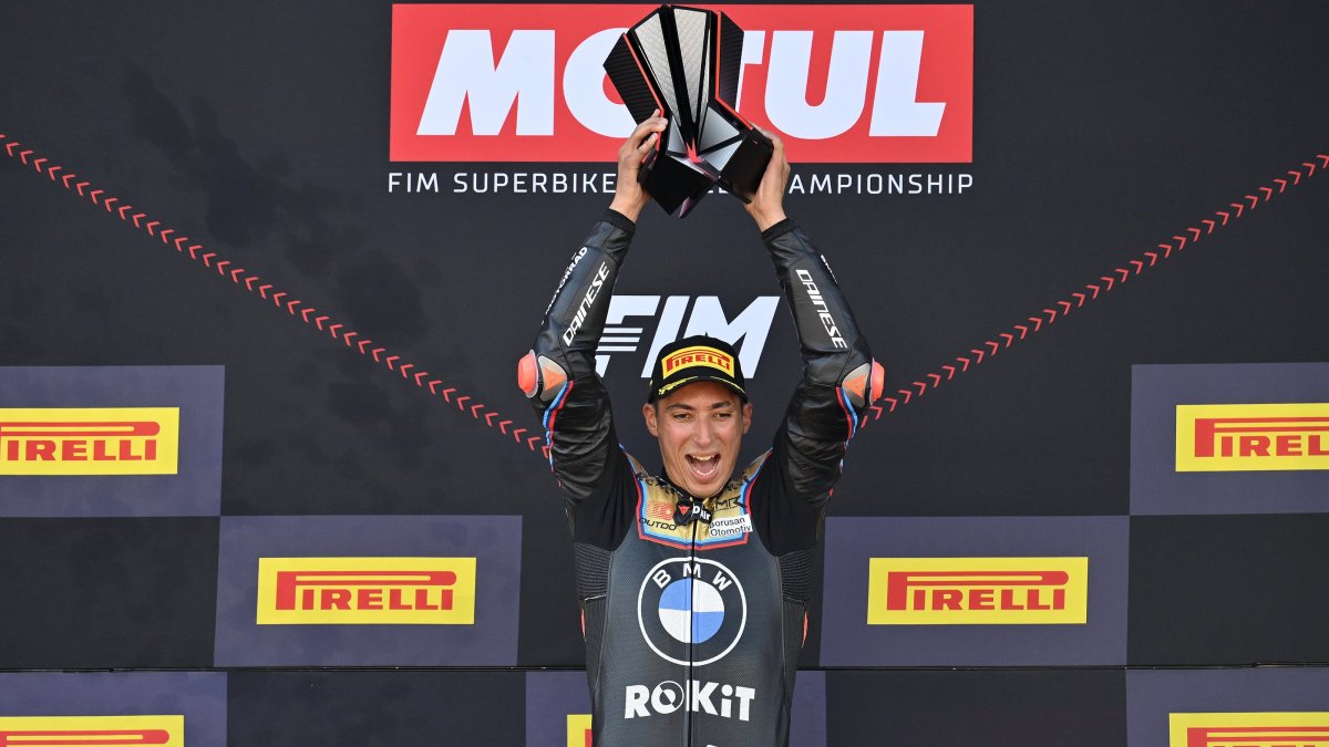 Turkish rider Toprak Razgatlıoğlu celebrates on the podium after winning the 2025 World Superbike Championship, lifting the trophy high as he secures his third world title, at Jerez Circuit, Jerez, Spain, Oct. 19, 2025. (AA Photo)