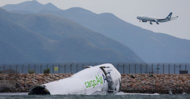The broken fuselage of a 747-400 cargo plane is seen after it skidded off a runway in Hong Kong, China, Oct. 20, 2025. (AA Photo)