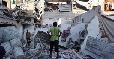 Palestinians inspect the damage around their homes after an Israeli strike targeted the previous day the Bureij refugee camp in the central Gaza Strip, Oct. 20, 2025. (AFP Photo)