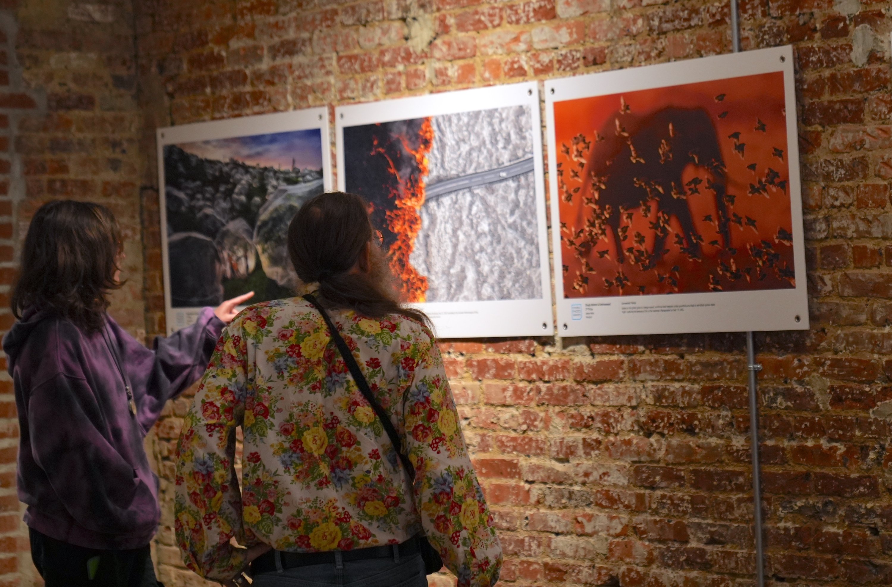 Visitors explore the Istanbul Photo Awards 2025 exhibition, Blue Gallery, New York, U.S., Oct. 20, 2025. (AA Photo)