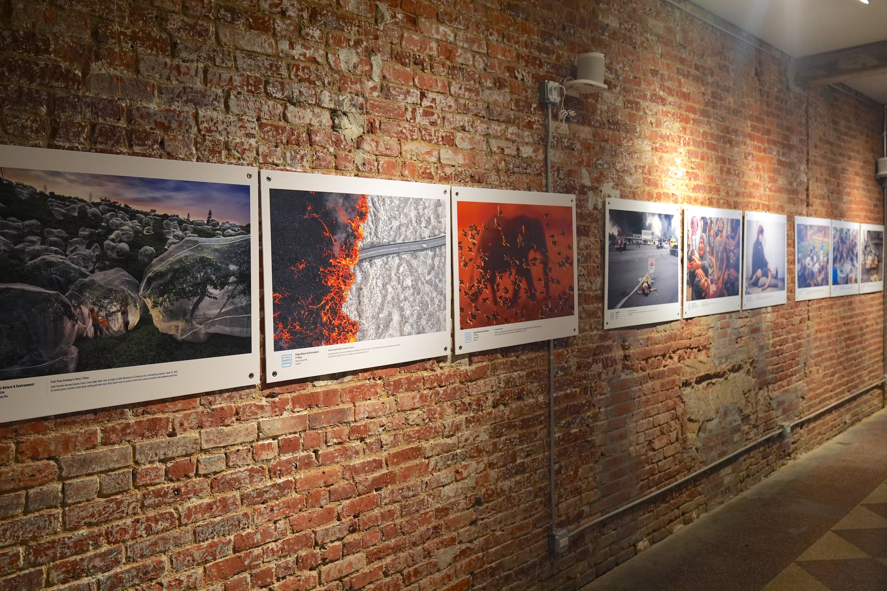 The award-winning photographs on display are seen during the third exhibition of the