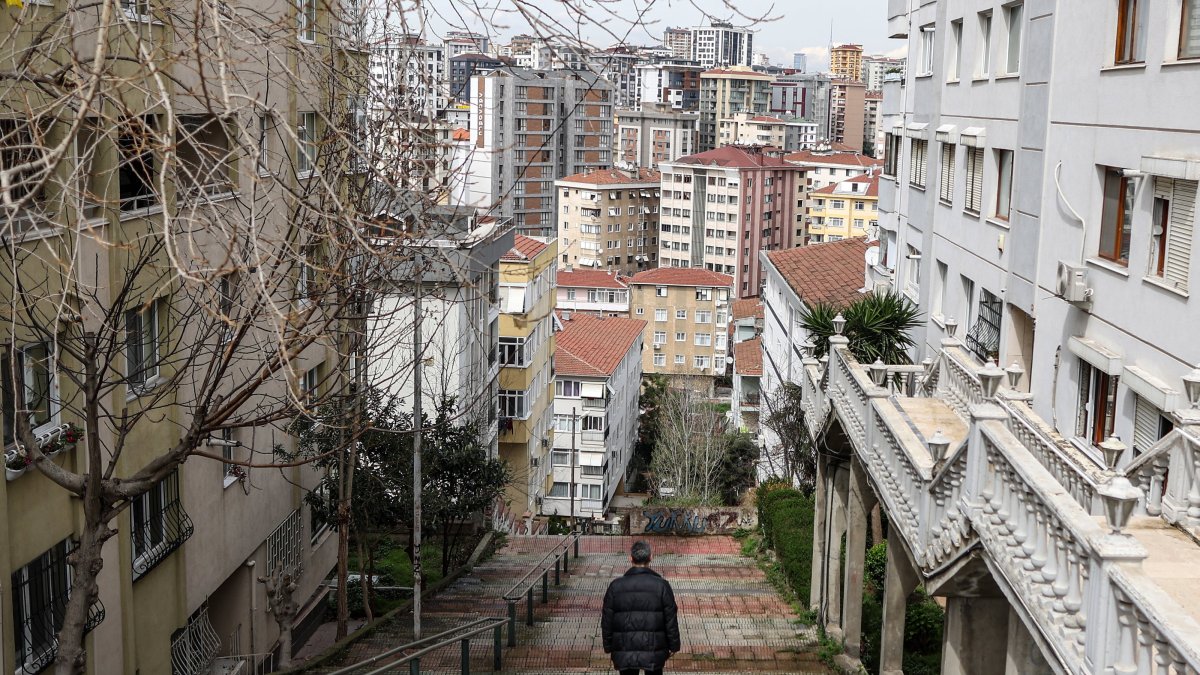 A man walks amid apartment buildings in the Maltepe district, Istanbul, Türkiye, April 3, 2023. (EPA Photo)