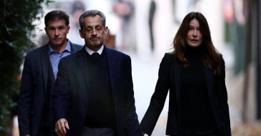 Former French President Nicolas Sarkozy leaves his house with his wife Carla Bruni-Sarkozy on the day of his incarceration at La Sante prison, in Paris, France, Oct. 21, 2025. (Reuters Photo)