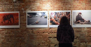 People visit the third exhibition of the &quot;Istanbul Photo Awards 2025&quot; international news photo competition, Blue Gallery, New York, U.S., Oct. 20, 2025. (AA Photo)