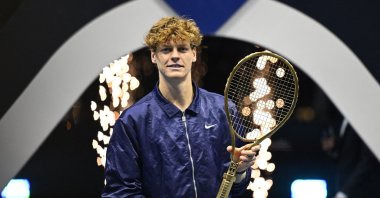 Italy&#039;s Jannik Sinner celebrates with a racket after winning the Six Kings Slam final against Spain&#039;s Carlos Alcaraz at ANB Arena, Riyadh, Saudi Arabia, Oct. 18, 2025. (Reuters Photo)