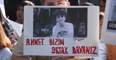 Supporters display a poster reading “Ahmet Mattia Minguzzi’s case is our common concern” outside the courthouse, Istanbul, Türkiye, Oct. 21, 2025. (DHA Photo)