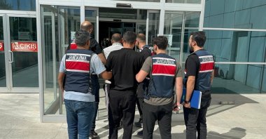 Security officers escort Daesh suspects captured in Adıyaman, eastern Türkiye, Oct. 2, 2025. (İHA Photo)