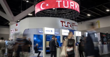 A logo of the Turkish Space Agency (TUA) is seen at the Türkiye pavilion during the recent  International Astronautical Congress (IAC) held in Sydney, Australia, Oct. 1, 2025. (AA Photo)