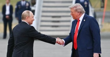 U.S. President Donald Trump greets Russian President Vladimir Putin on the tarmac after they arrived at Joint Base Elmendorf-Richardson in Anchorage, Alaska, Aug. 15, 2025. (AFP File Photo)
