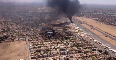 This video grab taken from AFPTV video footage shows an aerial view of black smoke rising above the Khartoum International Airport amid ongoing battles between the forces of two rival generals, Sudan, April 20, 2023. (AFP File Photo)