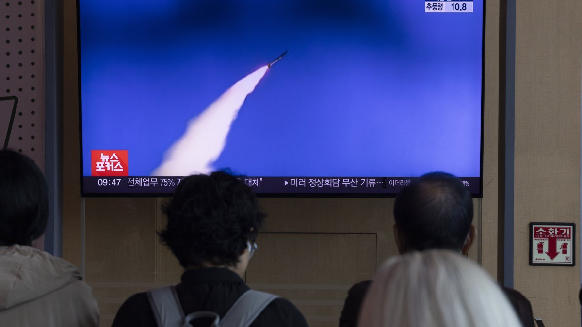 People watch a TV broadcast on North Korea firing short-range ballistic missiles, in Seoul, South Korea, Oct. 22, 2025. (EPA Photo)