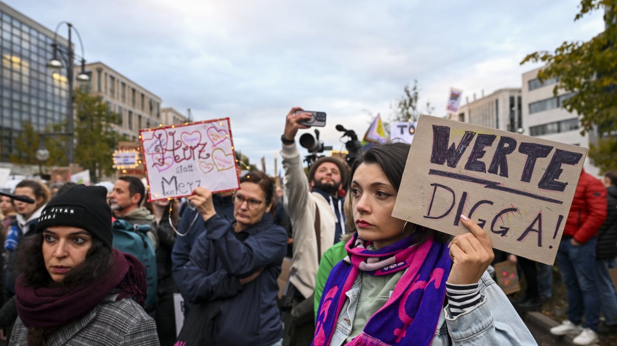 Protesters gather outside the Christian Democratic Union headquarters over Chancellor Friedrich Merz’s remarks on foreigners in cities, Berlin, Germany, Oct. 21, 2025. (AA Photo) 