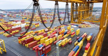 A photo taken from a container bridge shows containers stacked at the overseas port of Bremerhaven, northwestern Germany, Oct. 7, 2025. (AFP Photo)