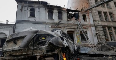 Firefighters work at the site of the kindergarten hit by a Russian drone strike, in Kharkiv, Ukraine, Oct. 22, 2025. (Reuters Photo)