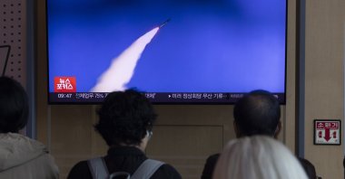 People watch a TV broadcast on North Korea firing short-range ballistic missiles, in Seoul, South Korea, Oct. 22, 2025. (EPA Photo)