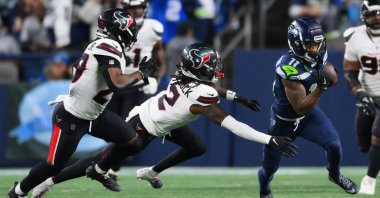 Seattle Seahawks wide receiver Jaxon Smith-Njigba (11) runs after a catch past Houston Texans safety Calen Bullock (2) during the second quarter at Lumen Field, Seattle, U.S., Oct. 20, 2025. (Steven Bisig/Imagn Images via Reuters)