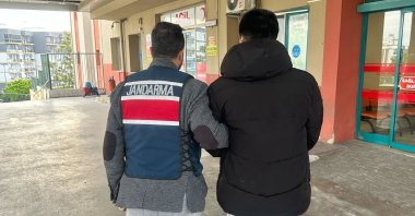 Gendarmerie forces escort the Daesh suspects, Izmir, Türkiye, Oct. 22, 2025. (IHA Photo)