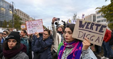 Protesters gather outside the Christian Democratic Union headquarters over Chancellor Friedrich Merz’s remarks on foreigners in cities, Berlin, Germany, Oct. 21, 2025. (AA Photo) 