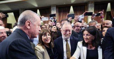 President Recep Tayyip Erdoğan is seen shaking hands with DEM Party lawmaker Pervin Buldan at a reception at Parliament, Ankara, Türkiye, Oct.1, 2025 (AA Photo)