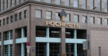 People walk past an office building of Rosneft, one of Russia&#039;s major oil companies, Moscow, Russia, Oct. 23, 2025. (Reuters Photo)
