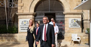 Tufan Erhürman of the Republican Turkish Party (CTP)(R) and his wife Nilden Erhürman leave the Supreme Court building a day after he was elected as the new president, Lefkoşa (Nicosia), TRNC, Oct.19, 2025 (AFP Photo)