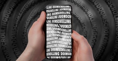 Experts highlight the detrimental effects on both physical and mental health caused by excessive exposure to negative content on digital platforms, a phenomenon known as &quot;doomscrolling&quot; or &quot;doomsurfing.&quot; (Shutterstock Photo)