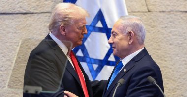 U.S. President Donald Trump speaks with Israeli Prime Minister Benjamin Netanyahu at the Israeli parliament, the Knesset, in Jerusalem, Oct. 13, 2025. (AFP File Photo)