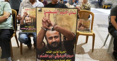 Supporters of popular Palestinian leader Marwan Barghouti carry posters with his pictures while protesting a video that was posted by an Israeli minister on Friday, showing him admonishing Barghouti in a meeting inside a prison, during a protest in the West Bank city of Ramallah, Tuesday, Aug. 19, 2025. (AP File Photo)