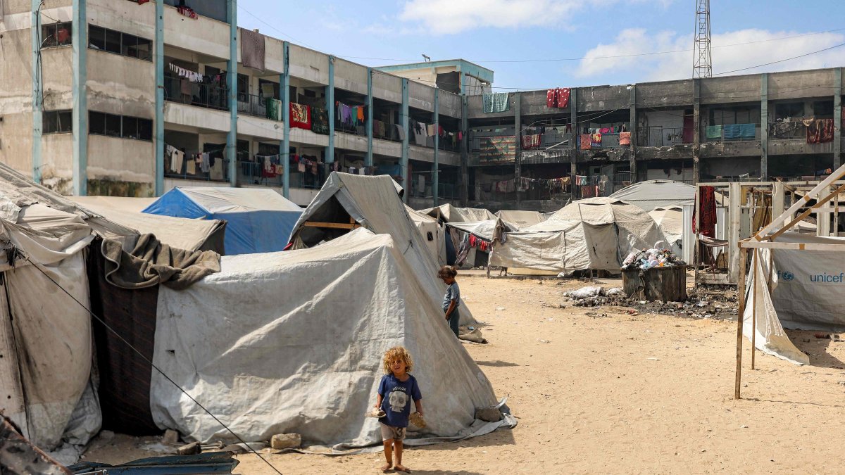 A girl stands outside one of the tents erected at a make-shift camp for people displaced by conflict in the yard of a school run by the United Nations Relief and Works Agency for Palestine Refugees (UNRWA), in Khan Younis in the southern Gaza Strip, Sept. 30, 2025. (AFP Photo)