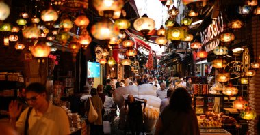 A porter pulls a trolley loaded with goods in the popular Eminonu commercial area of Istanbul, Türkiye, Sept. 24, 2025. (AP Photo)