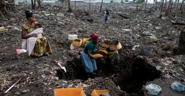 Kahindo, an internally displaced woman, who said they could not return home because it was destroyed during the fighting, gathers volcanic gravel to sell at an IDP camp, which was emptied after the M23 rebels ordered many displaced people to leave the camps in Mugunga district, Goma, DRC, March 22, 2025. (Reuters Photo)