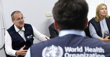 World Health Organization (WHO) Regional Director for Europe Hans Kluge (L) talks to his WHO colleagues as he visits victims of a fuel depot blast who are being treated at the National Burn Center, Yerevan, Armenia, Oct. 4, 2023. (AFP Photo)