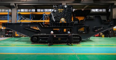 Workers are seen at a factory manufacturing machinery used in mining, construction and road building, Izmir, Türkiye, Oct. 24, 2025. (AA Photo)