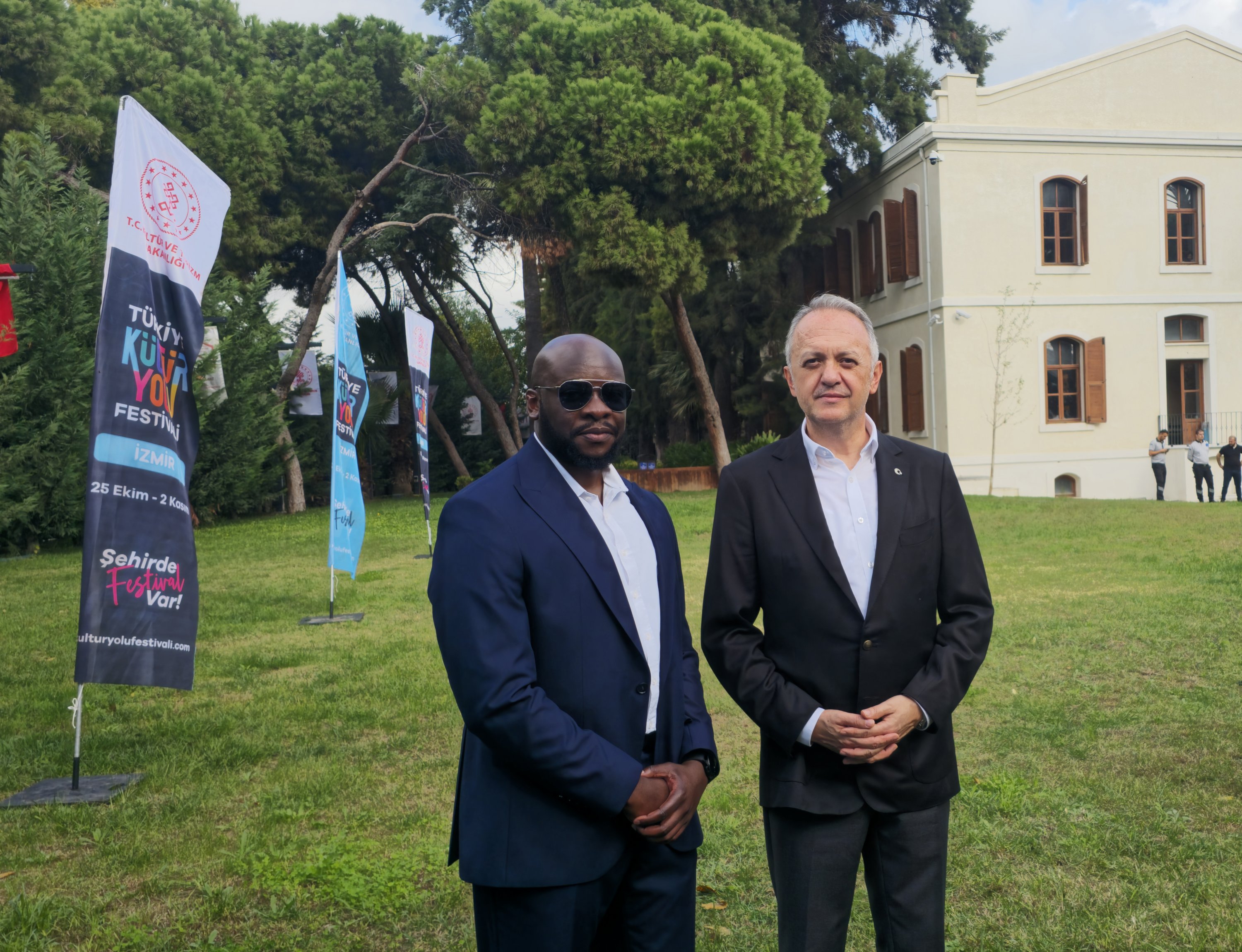 Culture and Tourism Deputy Minister Gökhan Yazgı (R) poses for a photo with Daily Sabah editor Kelvin Ndunga during the İzmir Culture Route Festival launch ceremony, İzmir, Türkiye, Oct. 25, 2025. (Courtesy of the Culture and Tourism Ministry)