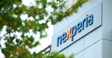 The logo of Chinese-owned semiconductor company Nexperia is displayed at the chipmaker&#039;s German facility, Hamburg, Germany, Oct. 23, 2025. (Reuters Photo)