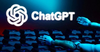 The ChatGPT logo, a keyboard, and robot hands are seen in this illustration taken Jan. 27, 2025. (Reuters Photo)
