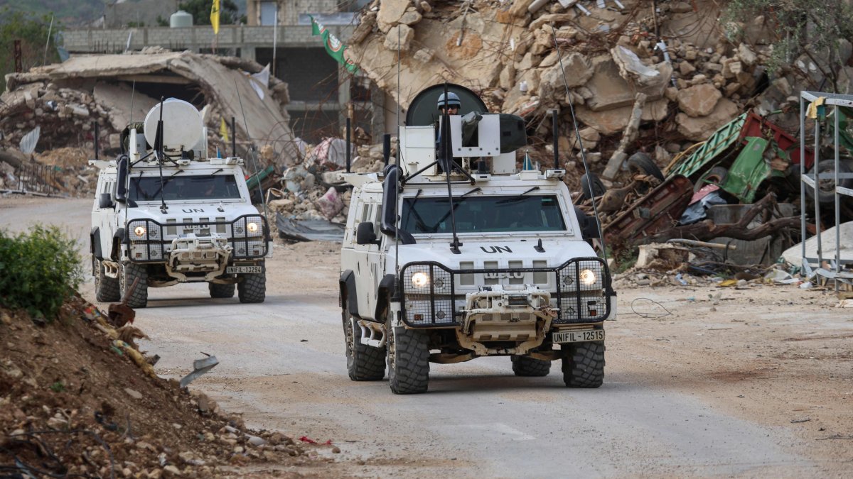 U.N. peacekeepers drive in past destroyed buildings while patrolling in Lebanon&#039;s southern village of Kfar Kila close to the border with Israel, April 6, 2025. (AFP Photo)